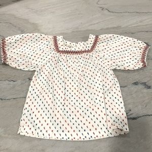 Cute peasant top with red, orange and blue stitching.
